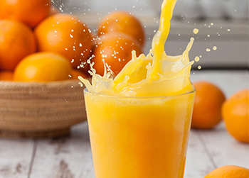 Orange juice pouring splash Orange juice pouring splash