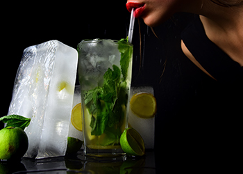 woman drink mojito with lime and mint. woman drink mojito with lime and mint.
