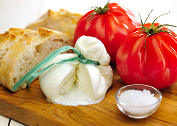Burrata (sort of very fresh mozzarella cheese), tomato and bread Burrata (sort of very fresh mozzarella cheese), tomato and bread
