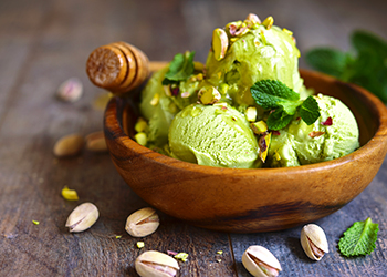 Pistachio ice cream with chopped nuts and honey. Pistachio ice cream with chopped nuts and honey.