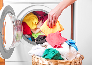 Woman and a washing machine. Woman and a washing machine.