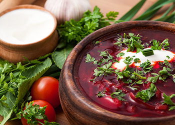 Borsch in a wooden plate