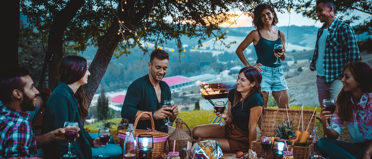 Group of friends eating in the nature